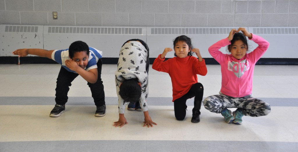 Four Primary students demonstrate their favorite angular low-level shapes.
